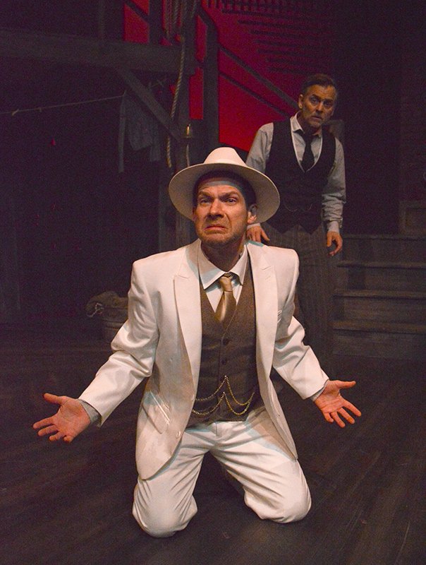 Jacob Marley (Eric Lee) tells Scrooge (Ben Gorman) his fate