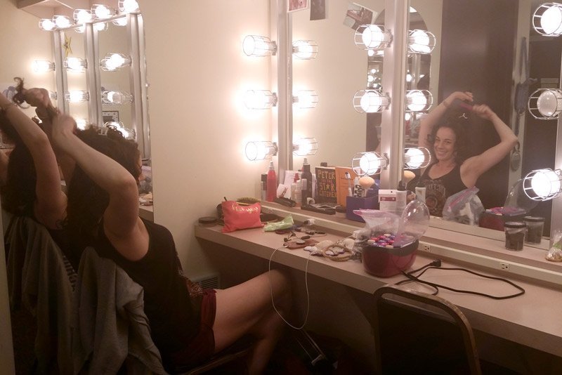 Lizzy prepares in the dressing room