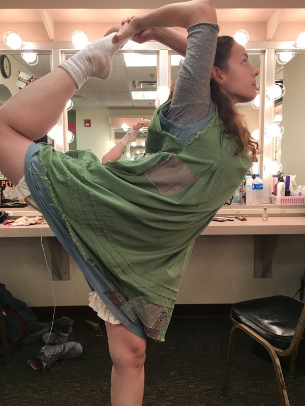 Lizzy Andretta stretching before Peter and the Starcatcher
