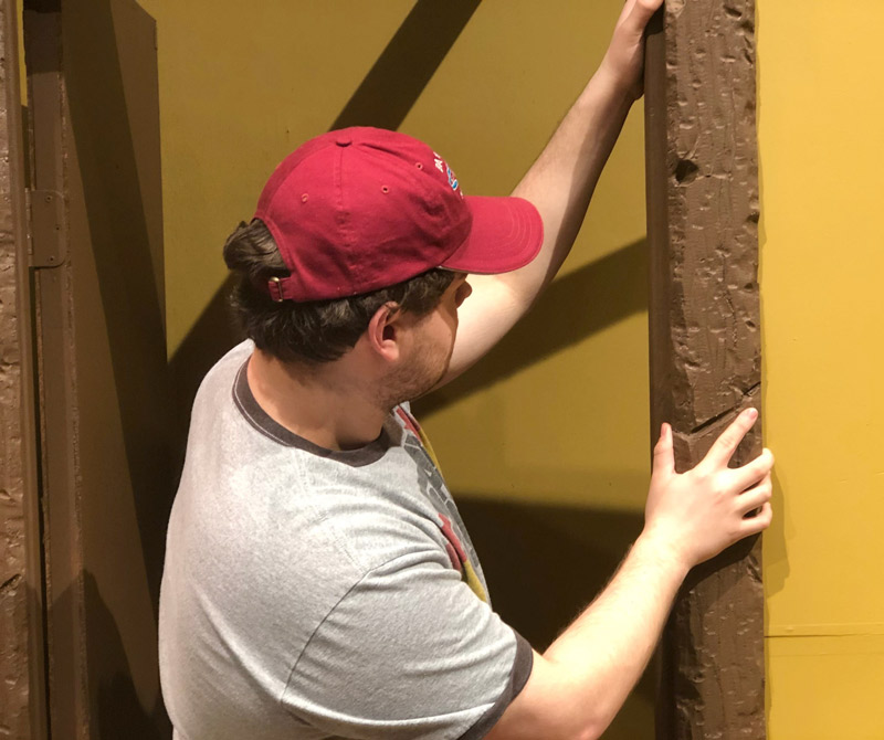 Apprentice Matt Donahue prepares the set of The Fox